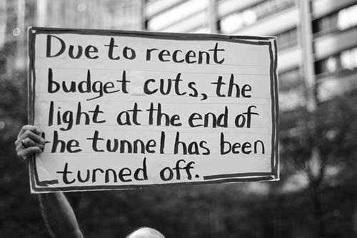 Due to recent budget cuts, the light at the end of the tunnel has been turned off.